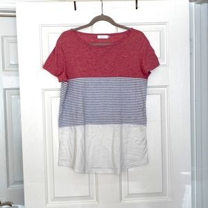 Color block tee with pink and grey stripes.